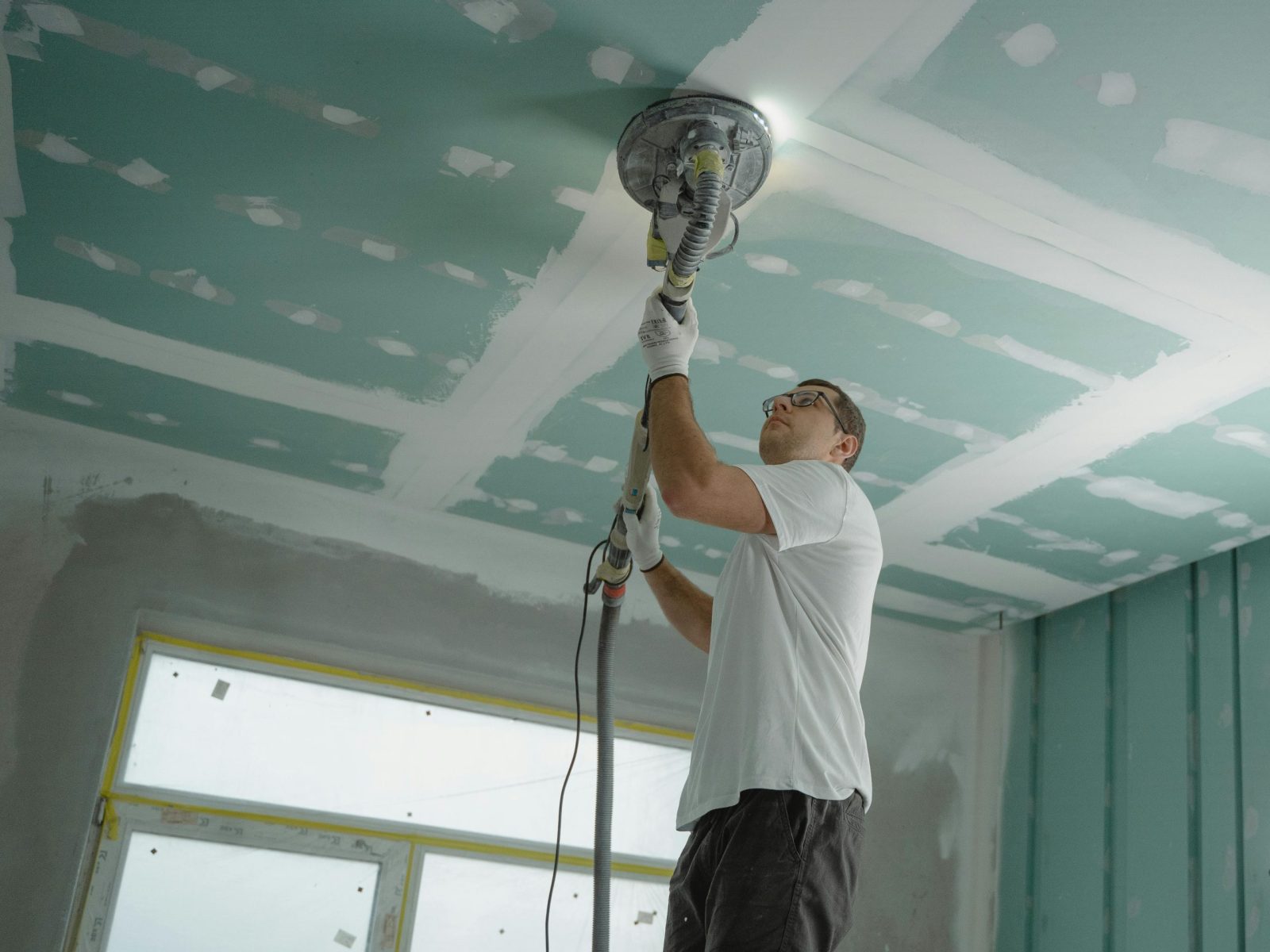 man polishing ceiling