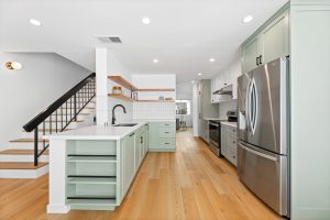 remodeled kitchen with tiled backsplash
