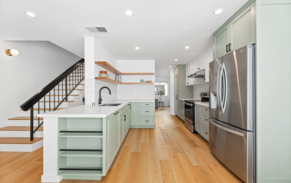 remodeled kitchen with tiled backsplash