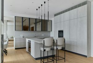 A gray kitchen with modern lightning