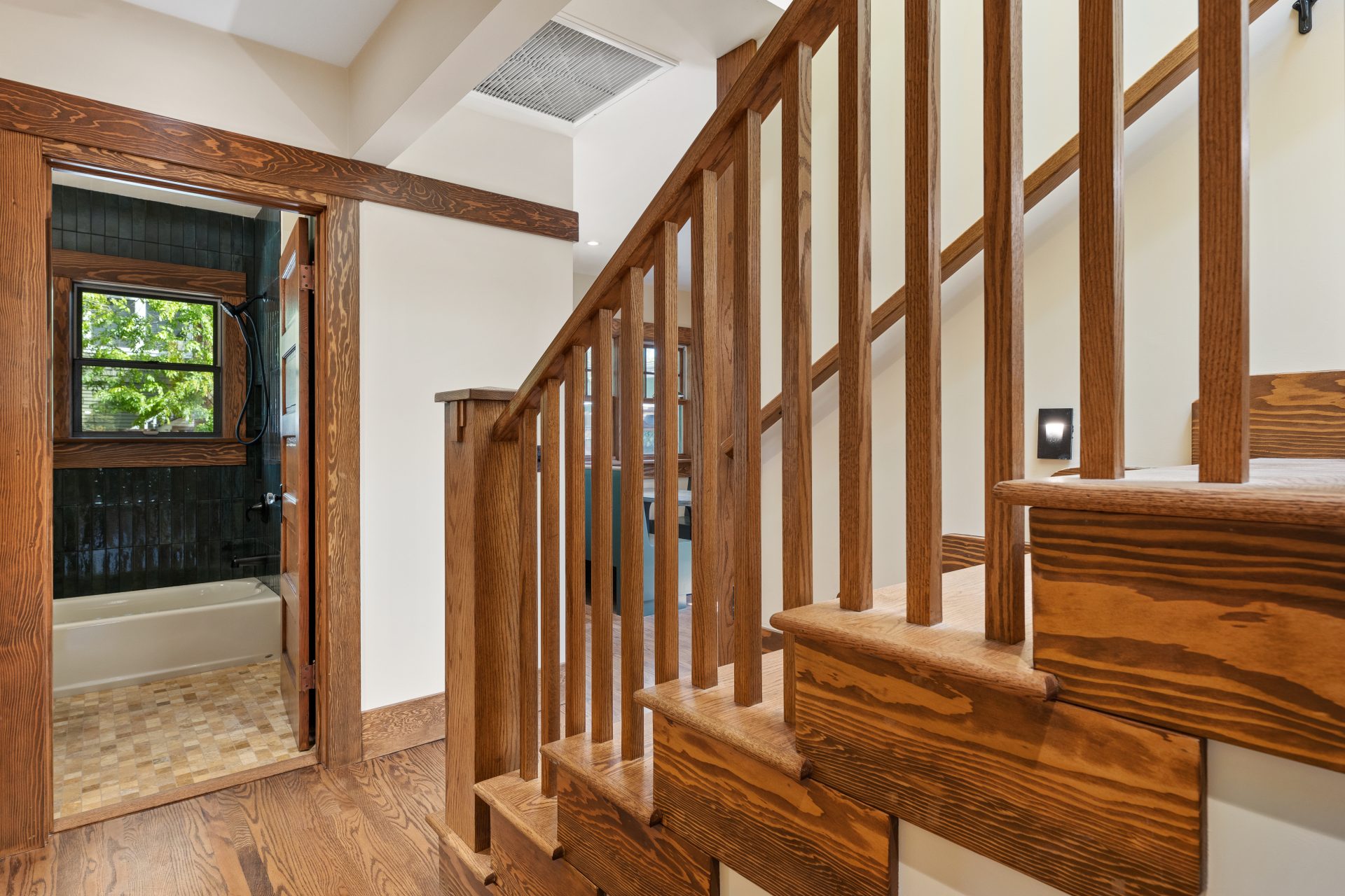 A beautifully remodeled staircase and railing