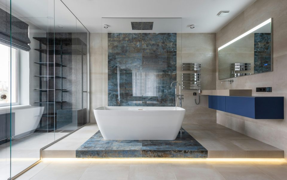 bathroom with tub and glass doors