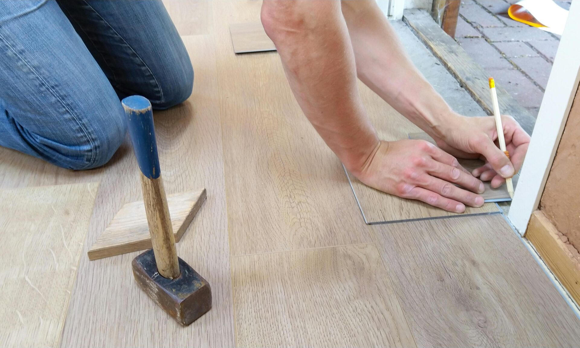 person holding a pencil during the whole home renovation