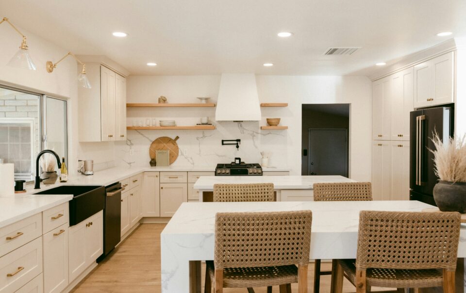 a kitchen with marble tables and backsplash