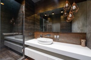 A modern bathroom with statement lighting