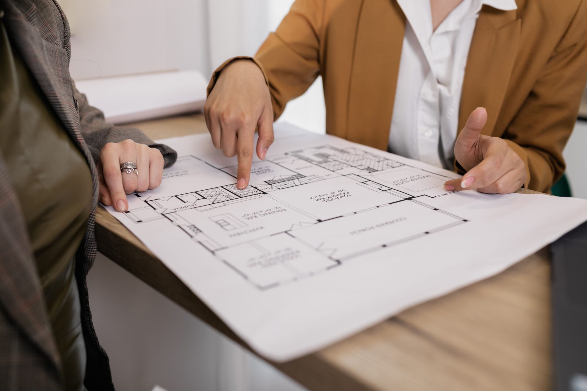 people looking at blueprints