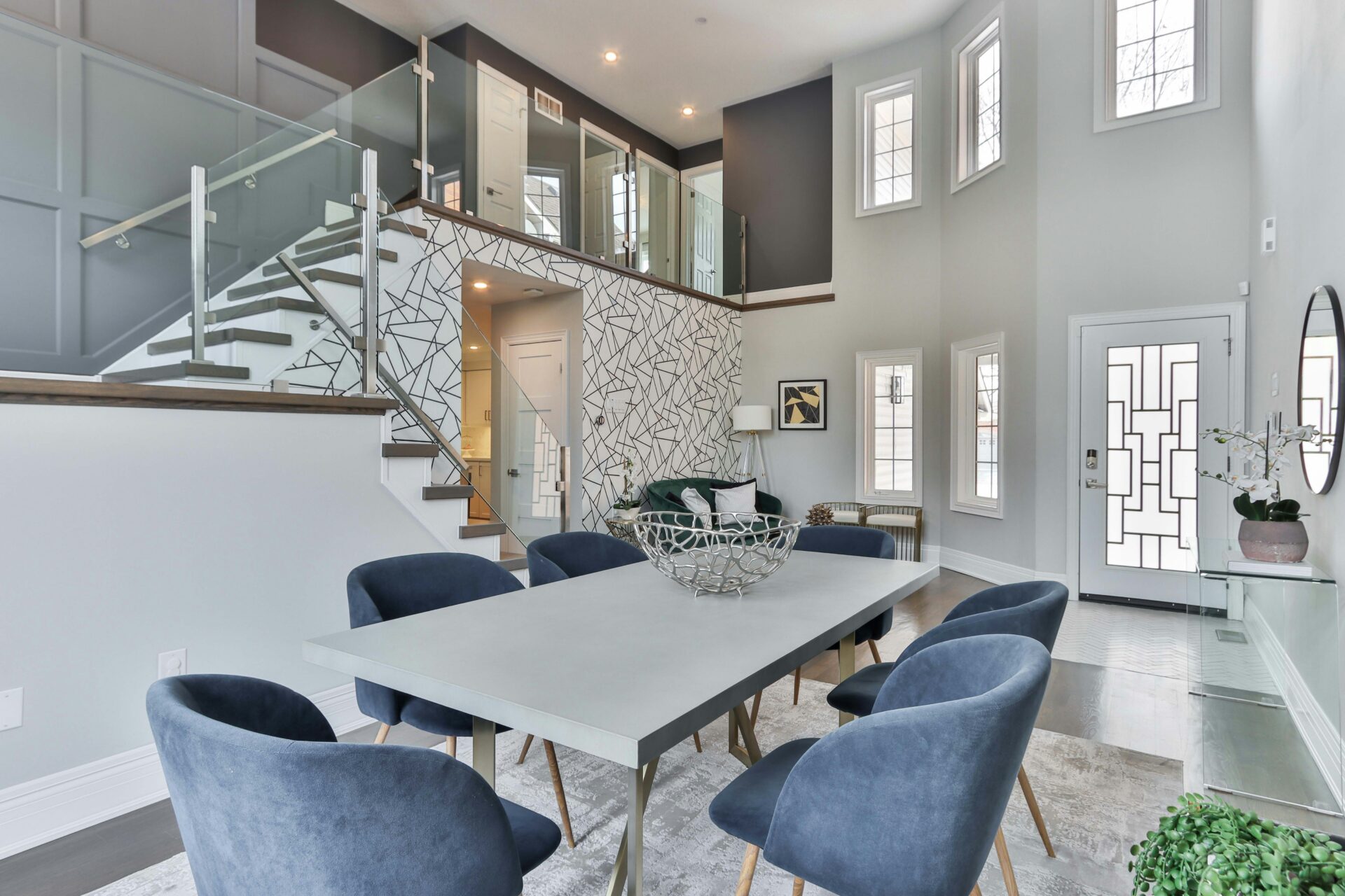 room with enclosed staircase and a table