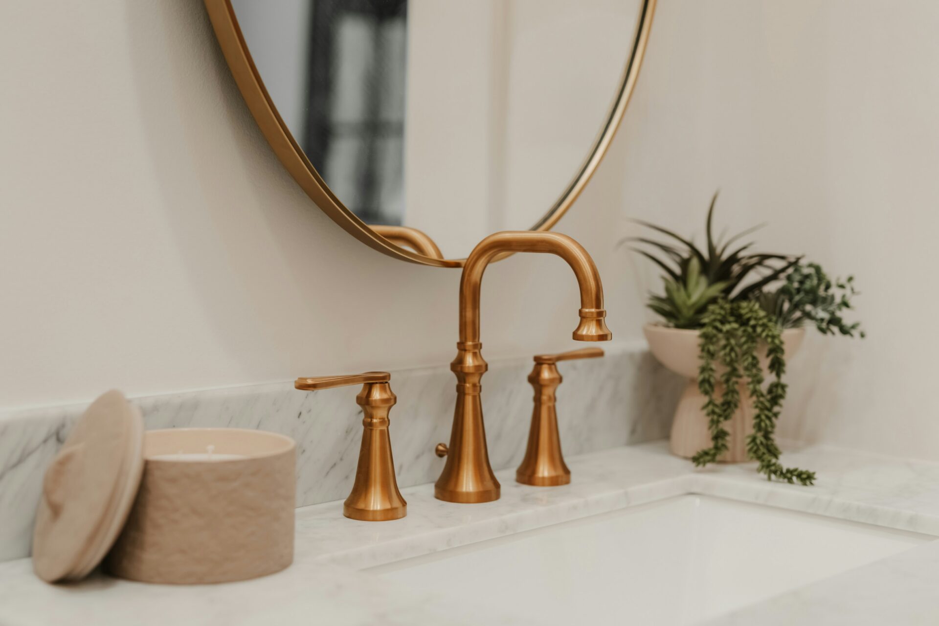 A sink with a brass faucet