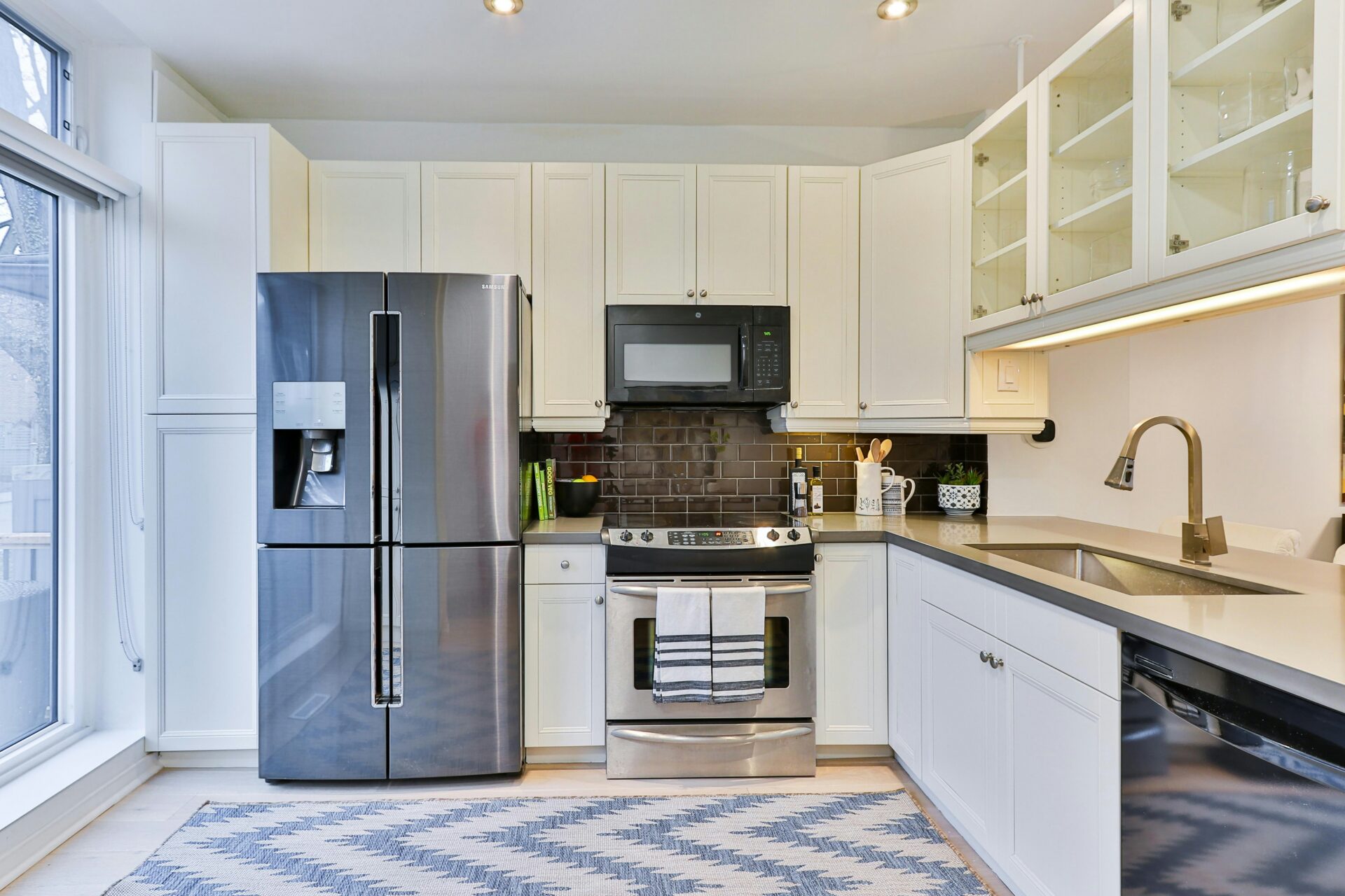 A kitchen with a French door refrigerator