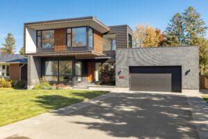 A modern sustainable home with a driveway