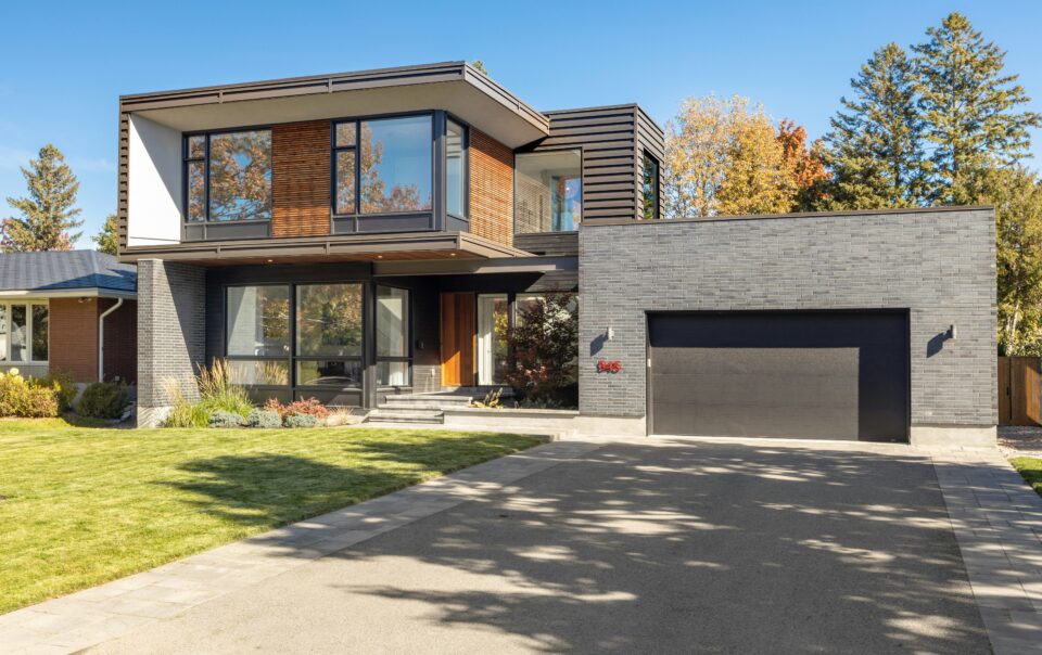A modern sustainable home with a driveway